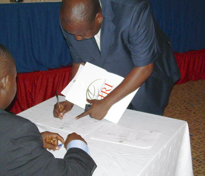 Charles Nwodo, chairman of the progressive action congress, signs the party code of conduct.  