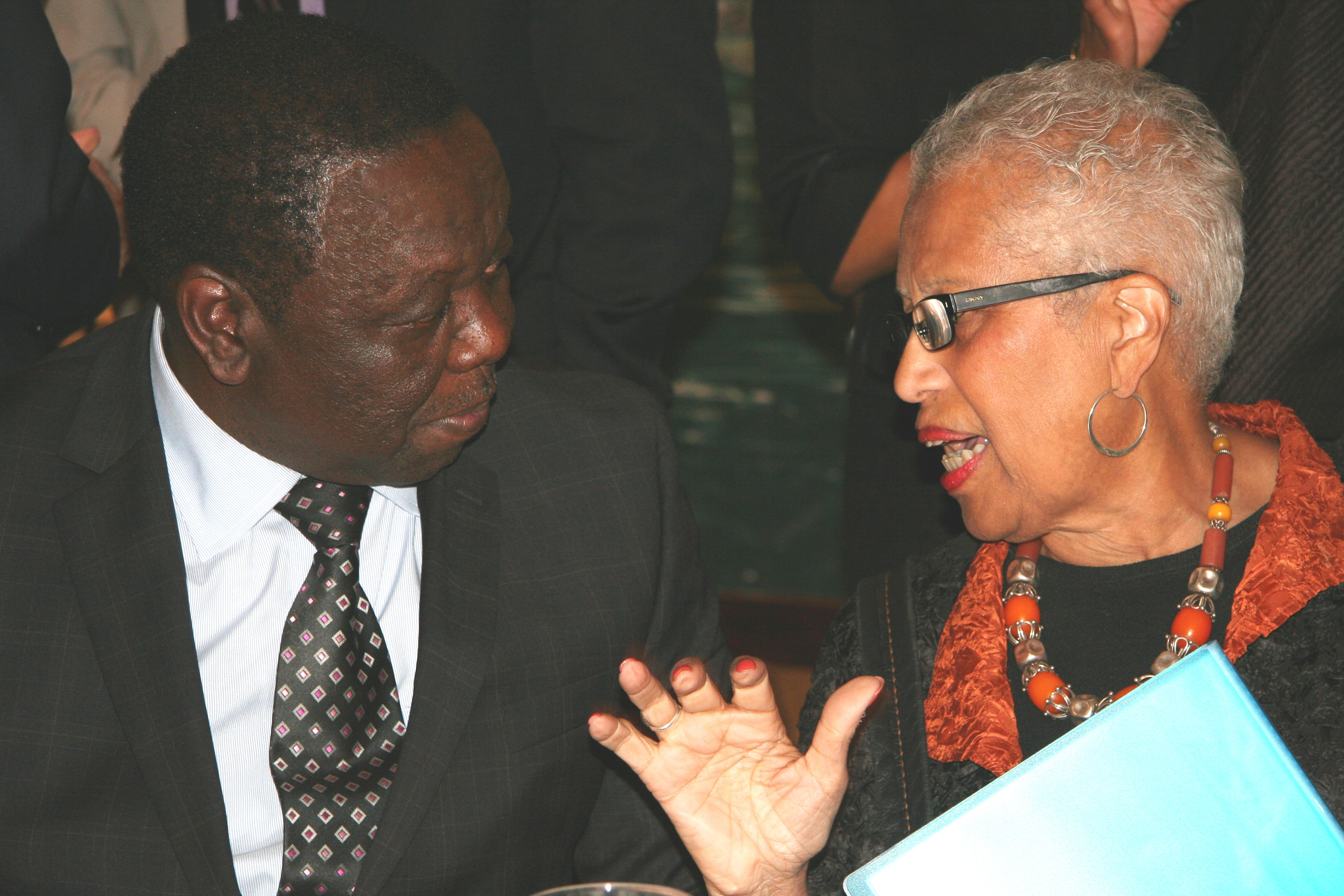 Newman (right) visits with the Prime Minister.