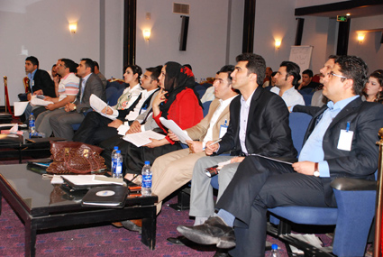 North Youth Center participants listen to a conference presentation. 