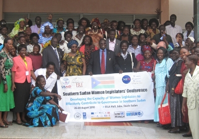 Recently elected members of the SSLA stand alongside the Vice President Machar (center) on the final day of the conference.