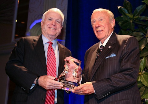 Senator McCain (left) presents the Freedom Award to Secretary Shultz.
