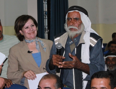 A voter asks a candidate a question at an IRI sponsored debate in Tafileh.