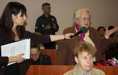 A woman asks a question during a public hearing in Inkerman.