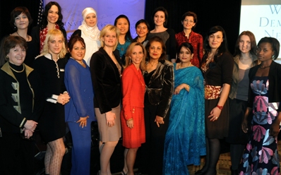 Delegates for the International Women's Day conference pose for a photo with Townsend.