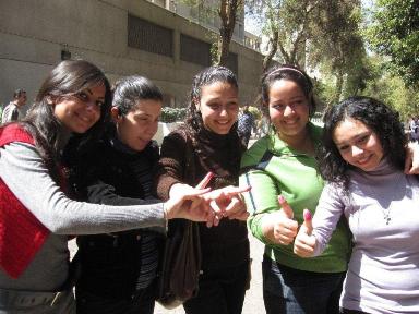 A group of young Egyptians show off their ink stained fingers after voting on March 19.