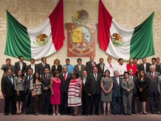 Oaxaca state legislators pose for a picture after passing major state reform bill.
