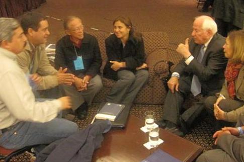 Kolbe (second from right) talks with newly-elected members of Peruvian Congress.