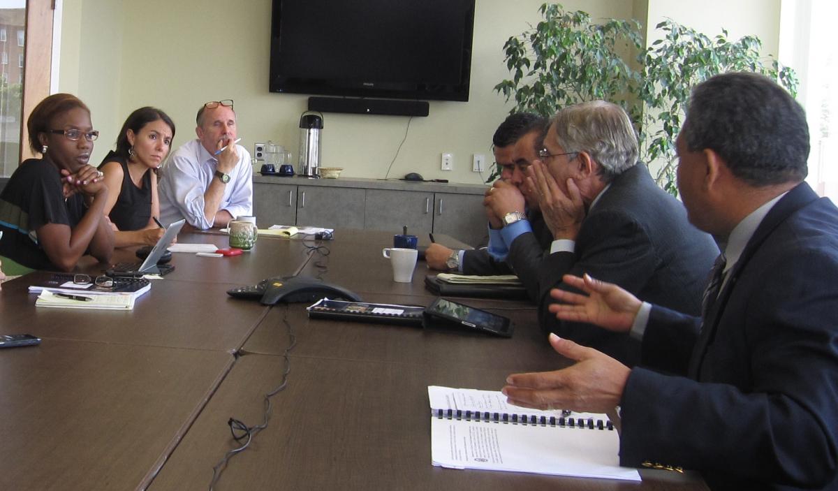 Delegates discuss youth violence and gang-prevention policies with a civil society group.