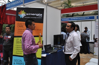 Government officials and vendors talk at the expo.
