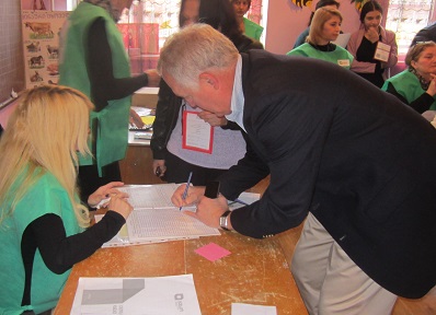 Congressman Shimkus signs in at a polling station in Tbilisi.