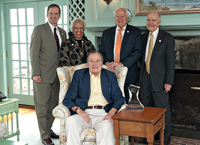 IRI board members and president with President Bush after presenting him with the Freedom Award at his home in Kennebunkport, Maine.