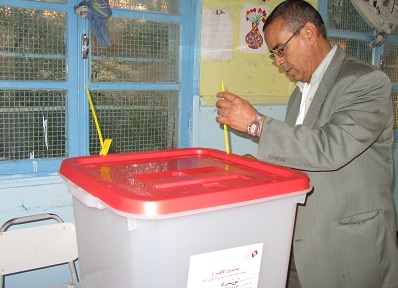 An election official seals a ballot box, in full view of observers during Tunisia’s 2011 elections.