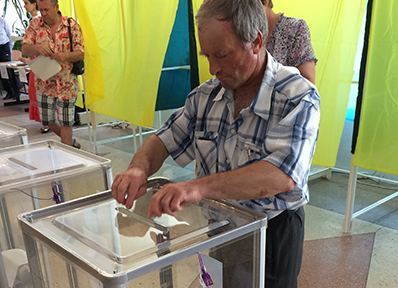 A man casts his ballot at a polling station during the 2014 presidential election.