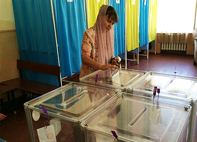A woman casts her ballot at a polling station during the 2014 presidential election in Kyiv.