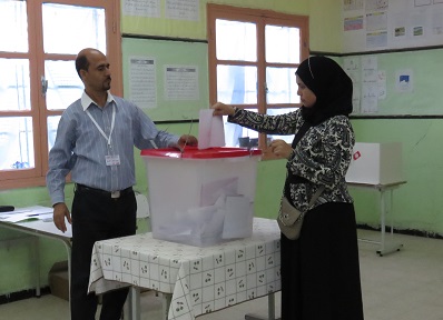 A woman casts her ballot in the October 26 parliamentary elections.