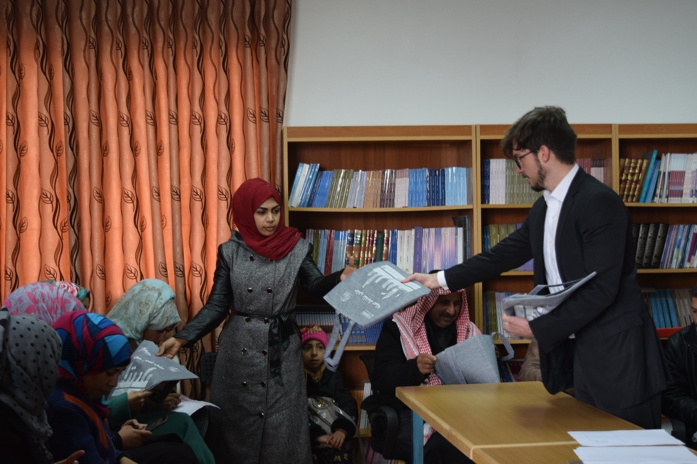 Distributing reusable bags to residents of Sabha, Jordan