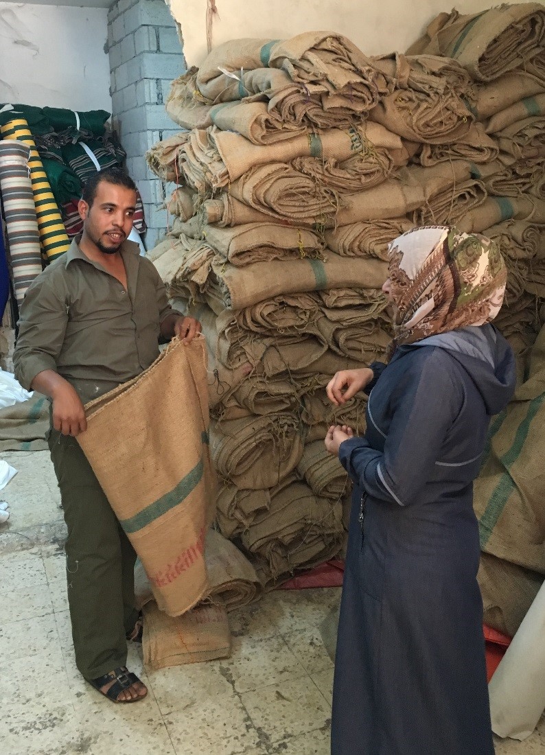 Collecting used grain sacks in Mafraq, Jordan to be sewn into reusable shopping bags