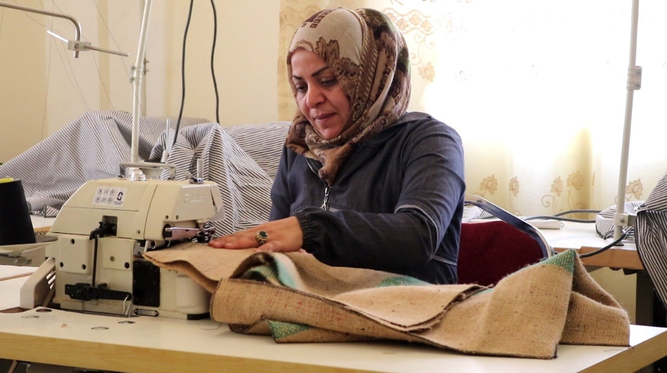 Sewing a reusable shopping bag at Al-Keram Association in Mafraq, Jordan