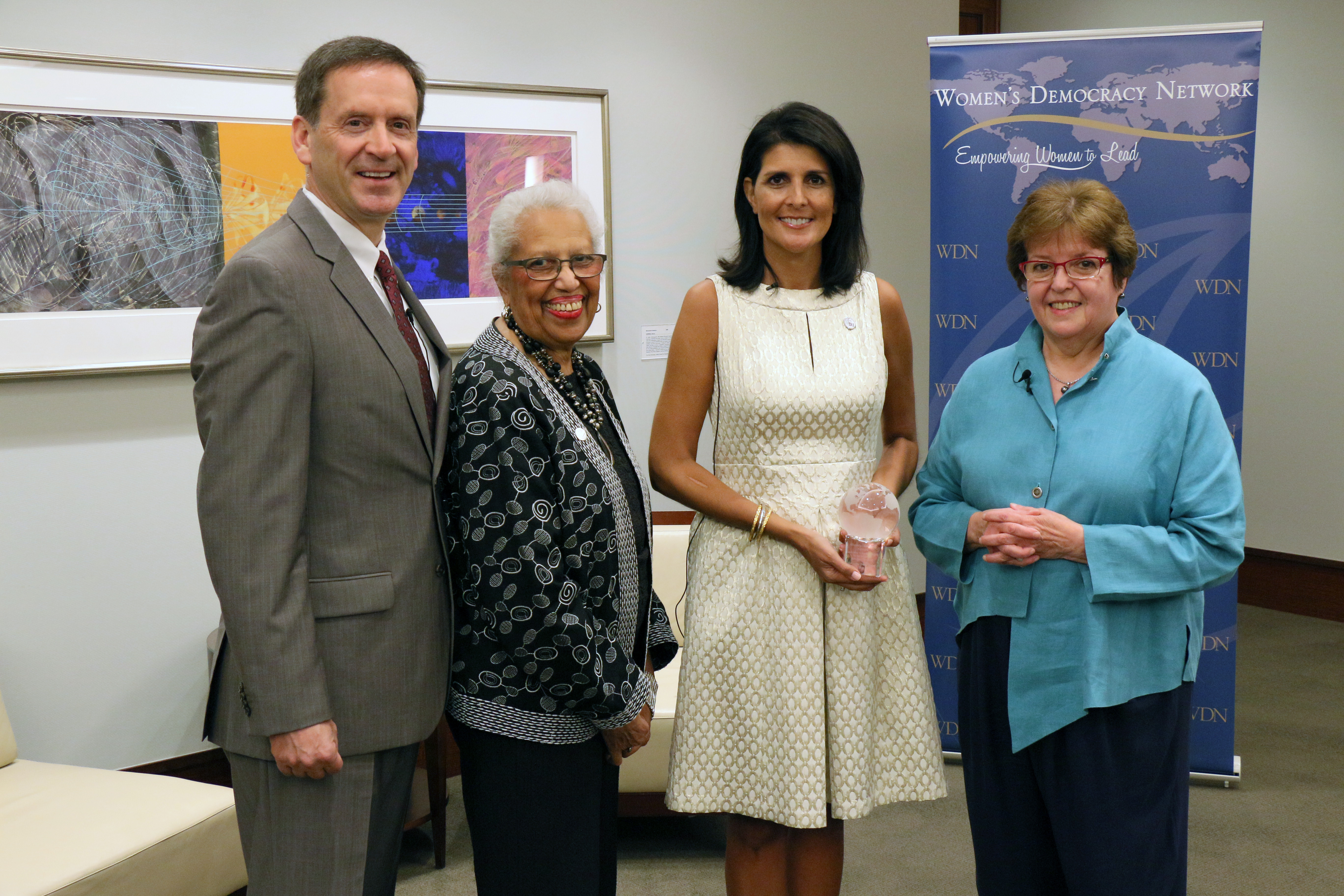 Ambassador Mark Green, IRI Board Member Connie Newman and IRI Executive VP Judy Van Rest present Governor Nikki Haley with the WDN 10 for 10 award. 
