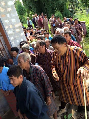 Voters waiting outside a polling station to elect their local government 