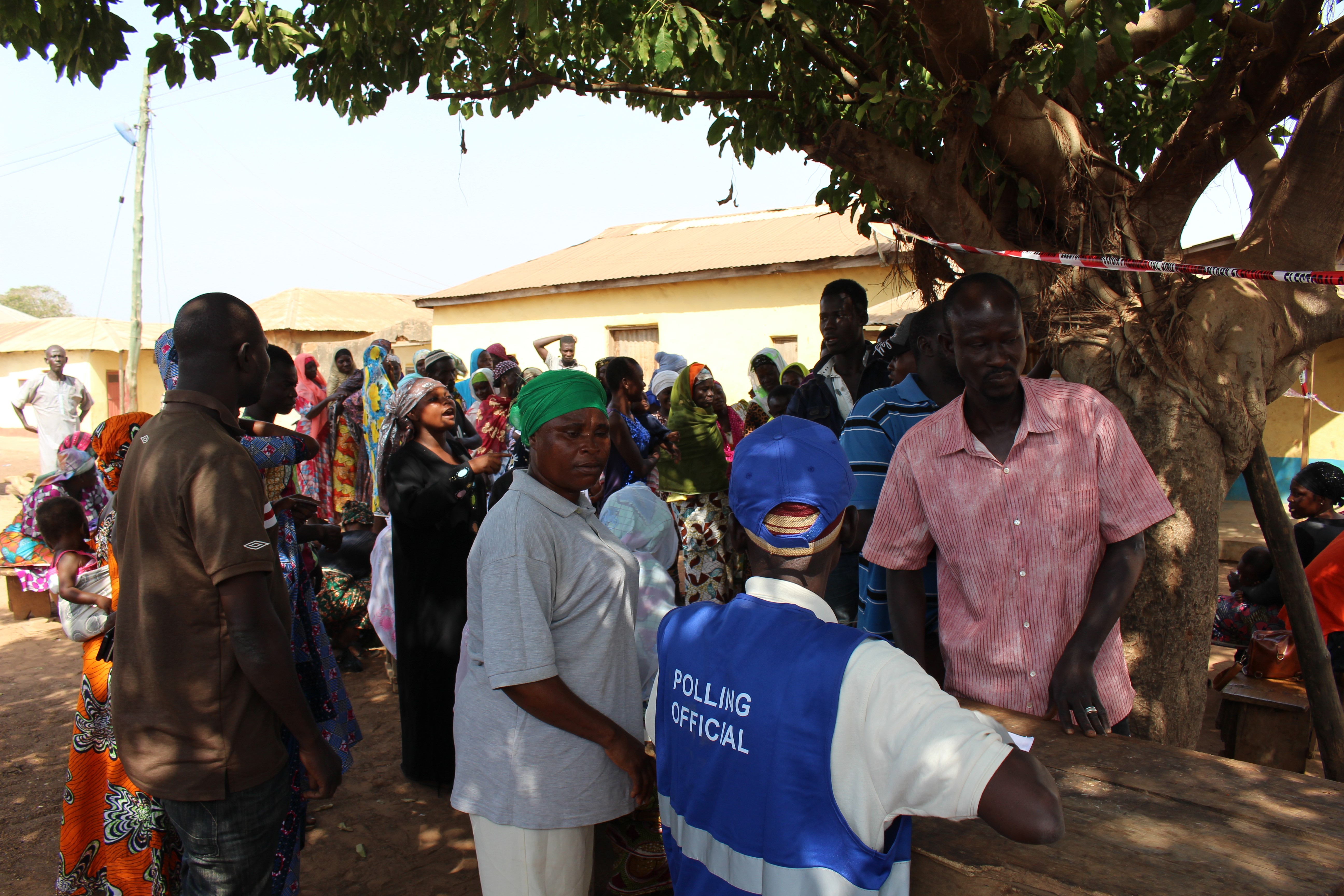 Madam T, in a discussion with a polling official in Yendi, Northern Ghana