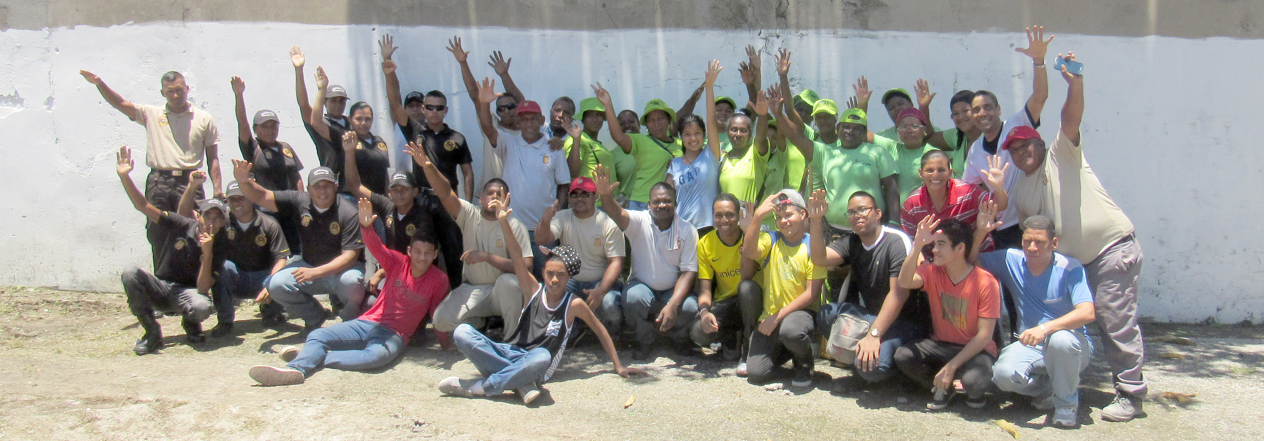 Youth from the Santa Ana neighborhood of Panama City celebrate their first public space clean-up with community volunteers.  