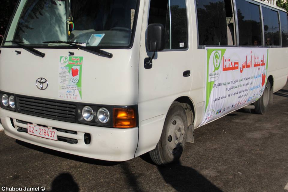 A caravan of health professionals and voter education volunteers makes a stop in rural Gafsa. 