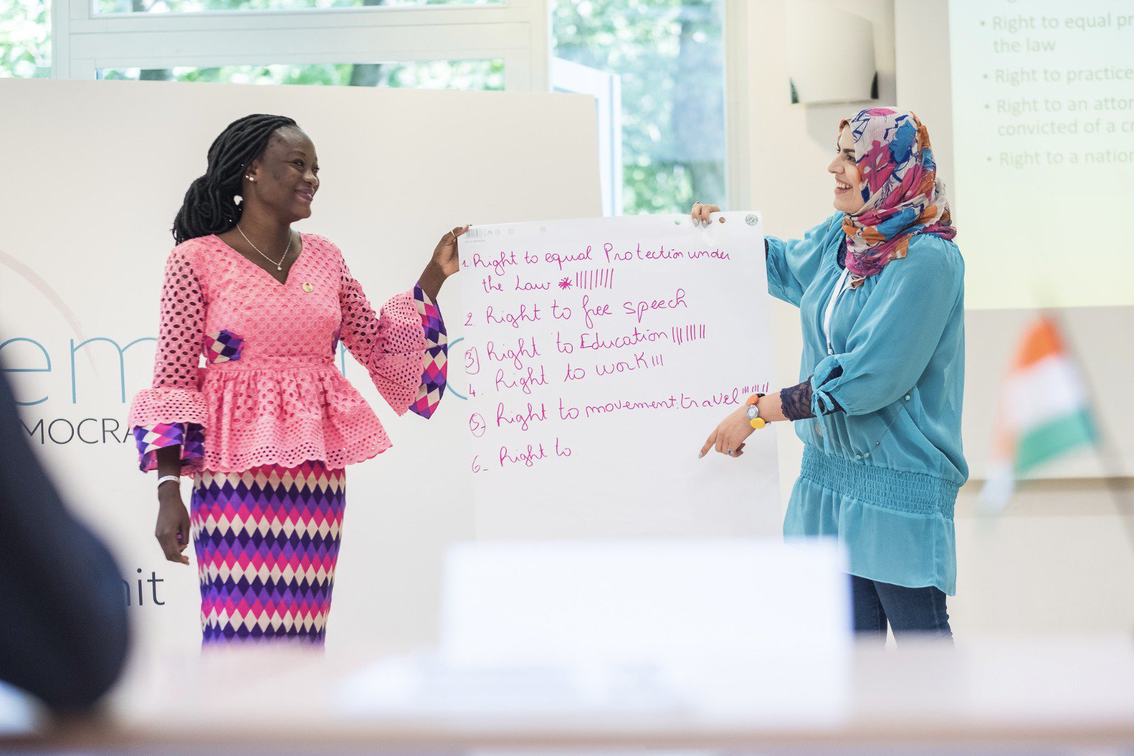 Two women present a presentation