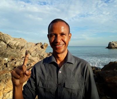 Voter with ink on finger