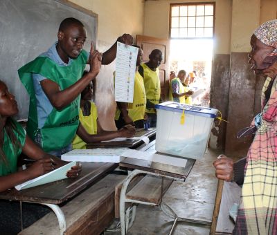 A woman prepares to cast her ballot