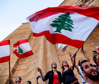 Lebanese demonstrators wave national flags