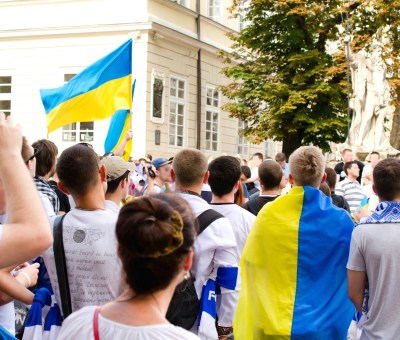 People Protesting On Street With Ukrainian Flag