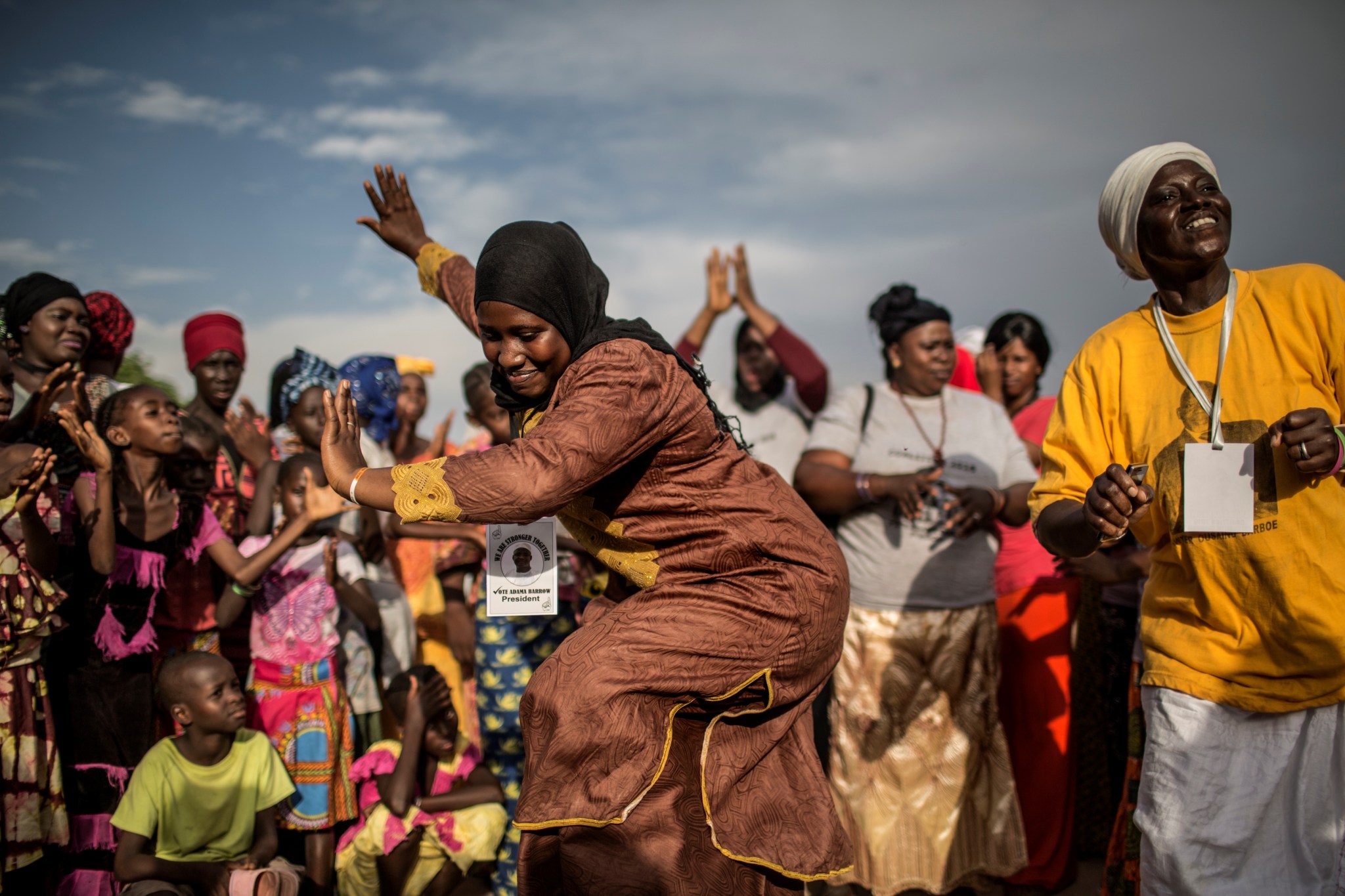 Gambians dancing at political rally