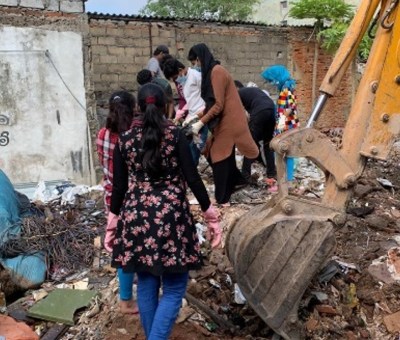 ELA members demonstrating 'democracy at work' while clearing a community dumping ground in coordination with local government authorities.