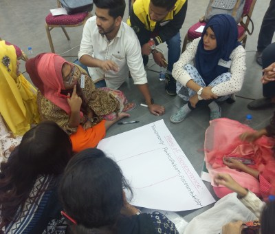Group meets to create poster on the pillars of governance