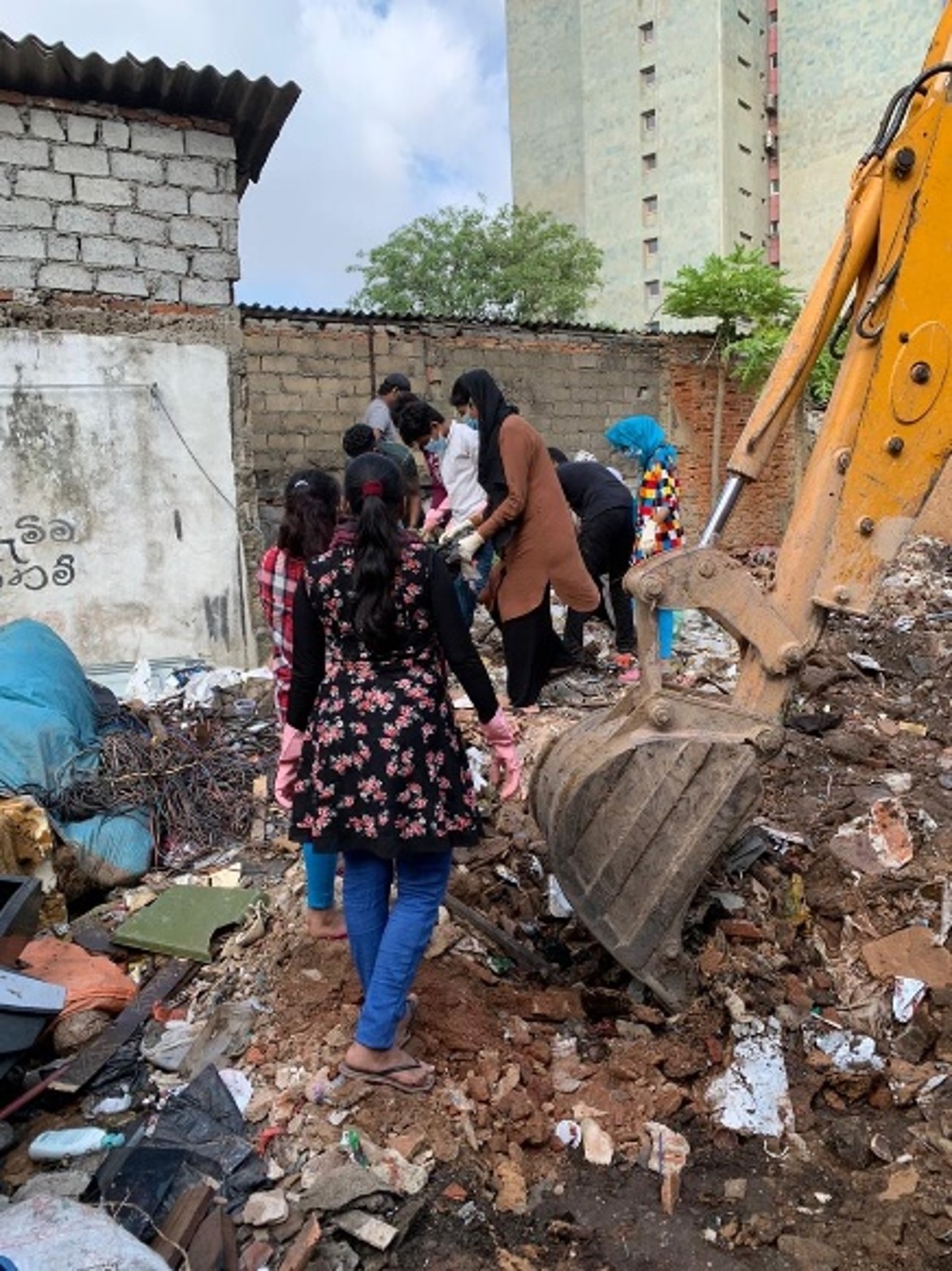 ELA members demonstrating 'democracy at work' while clearing a community dumping ground in coordination with local government authorities.