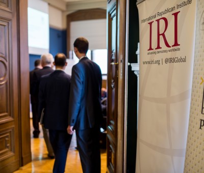 People Enter Room for IRI Meeting