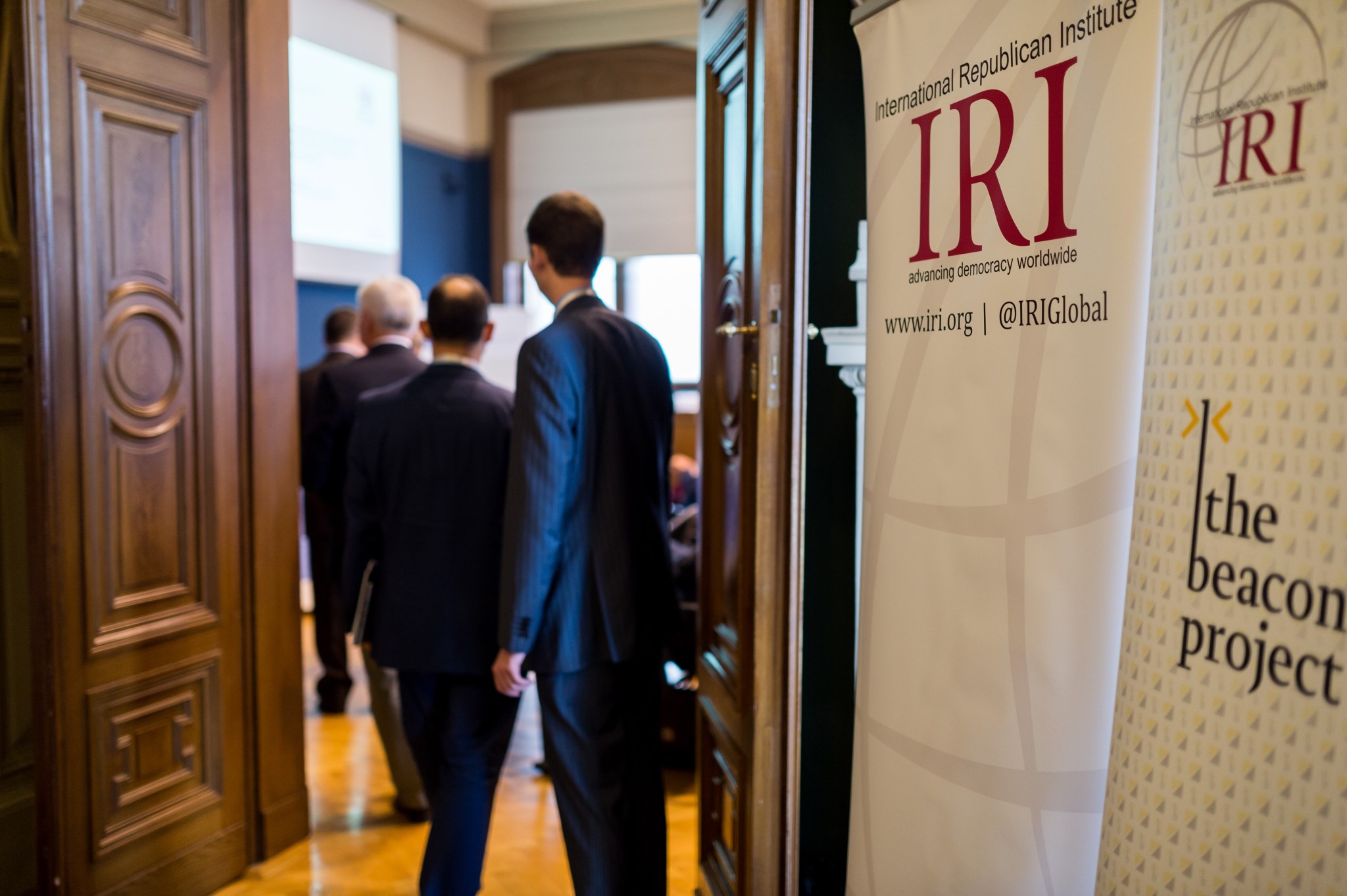 People Enter Room for IRI Meeting