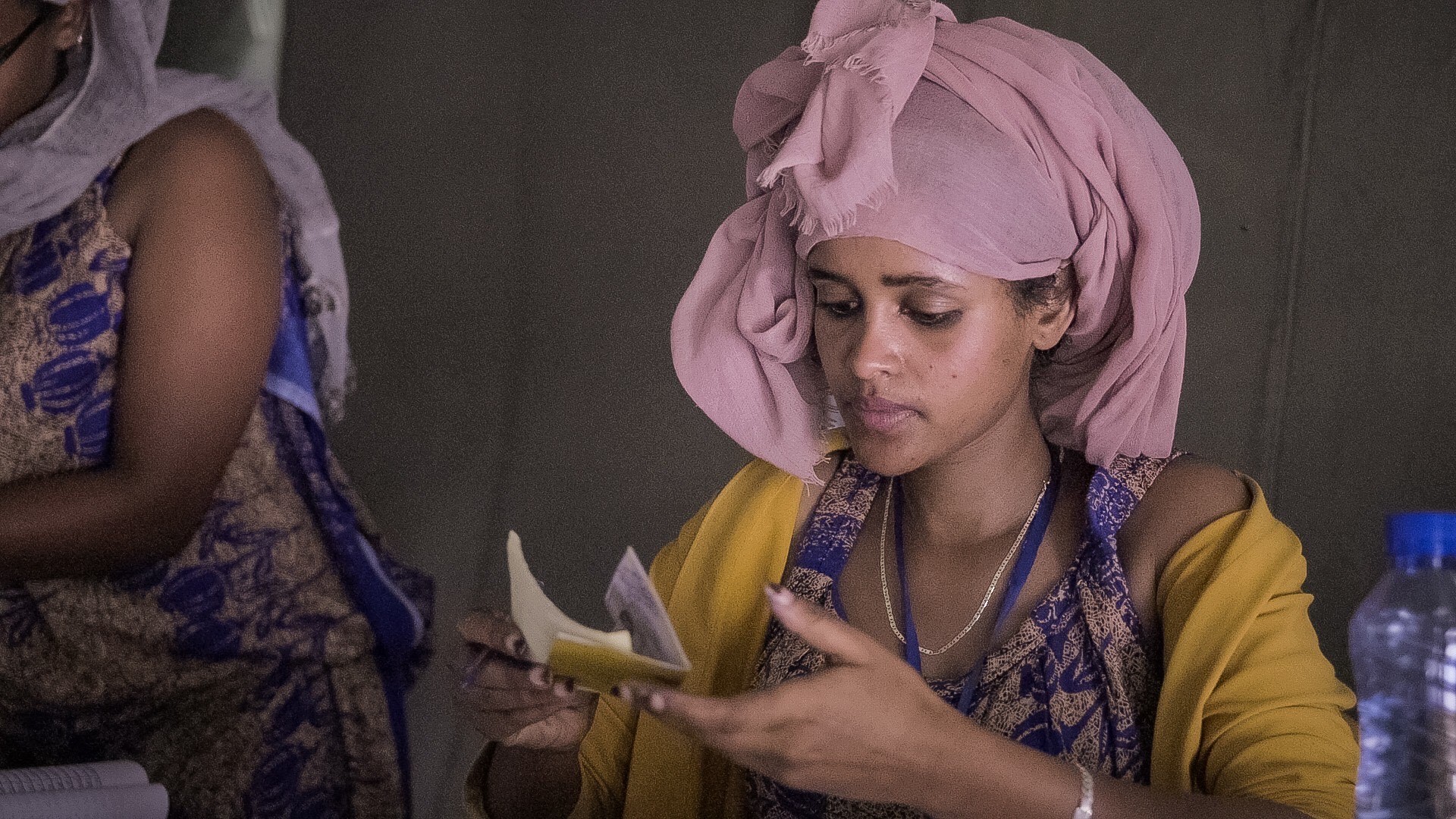 A woman looking at a paper