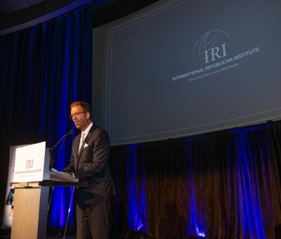 A man at a podium for the Freedom Award Honorees