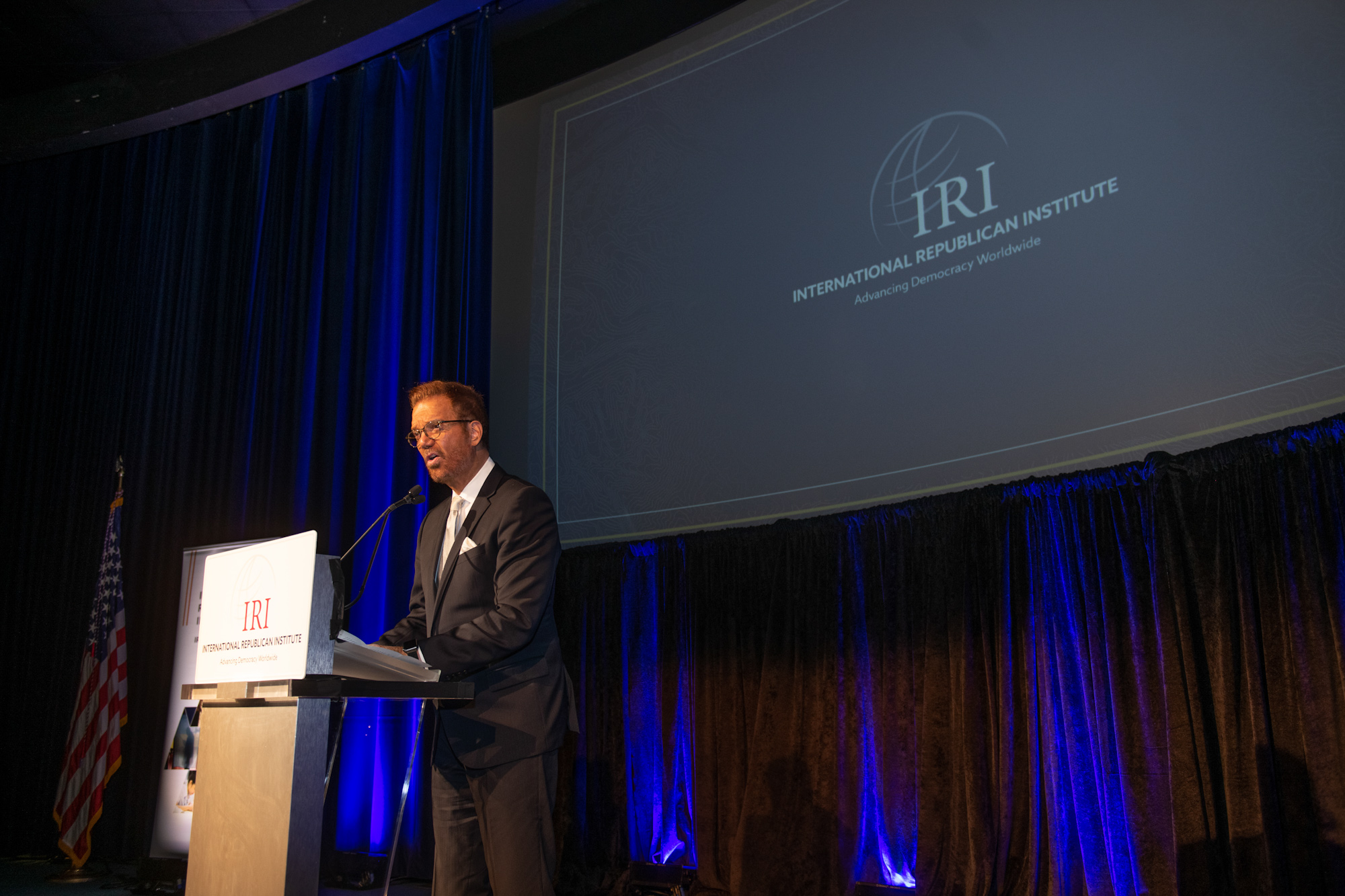 A man at a podium for the Freedom Award Honorees