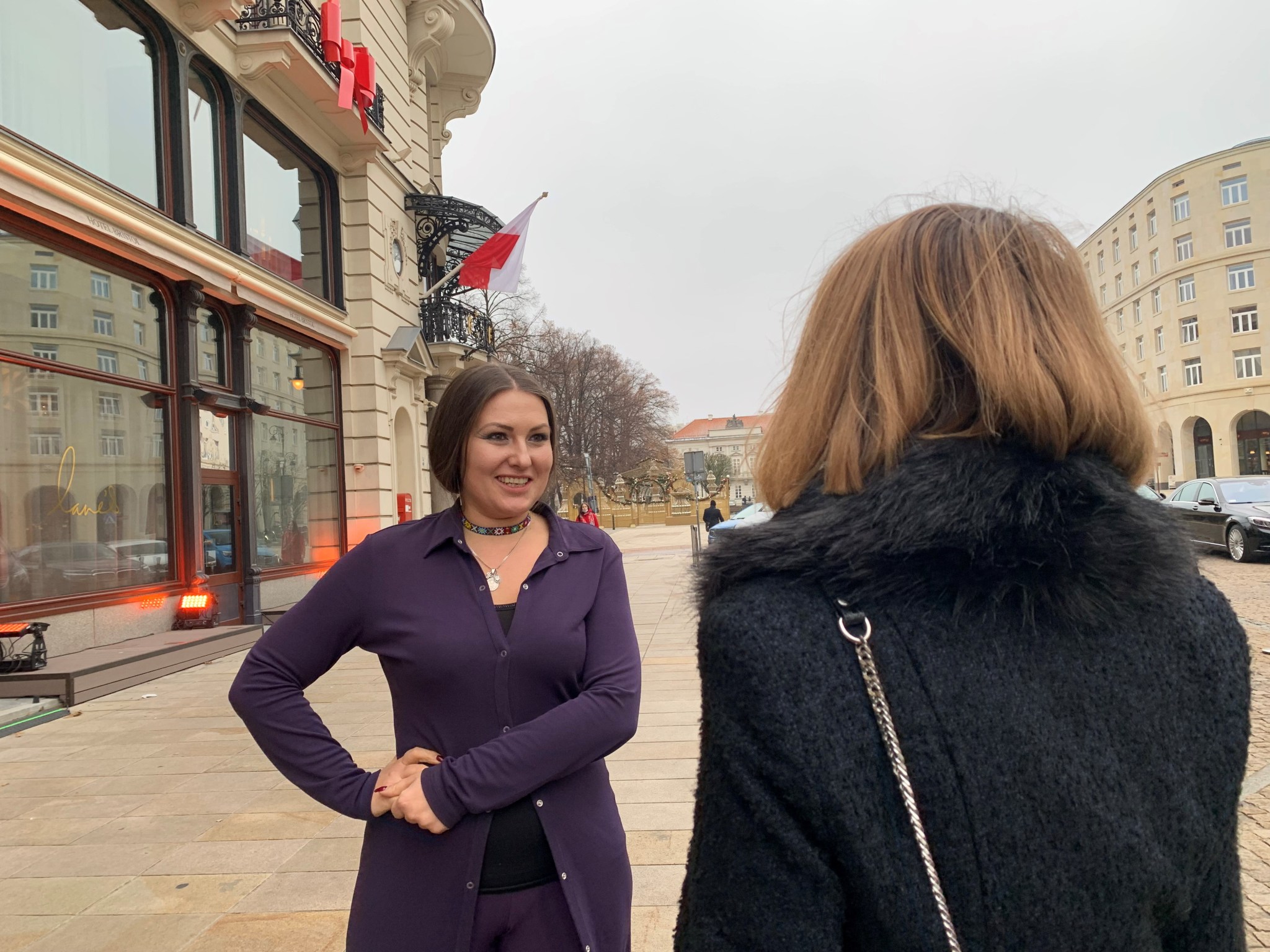 A member of the Ukrainian Parliament talks with another lady outside