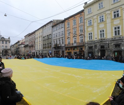 Ukrainians holding large flag