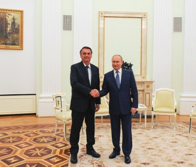 Brazil's President Jair Bolsonaro and President Vladimir Putin Shaking Hands