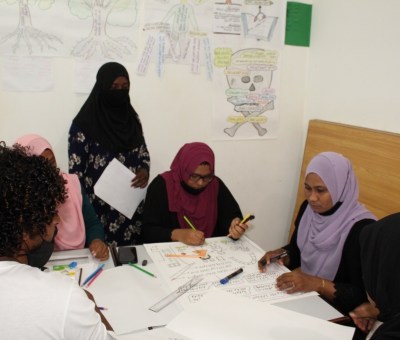Participants in workshop sitting around a table