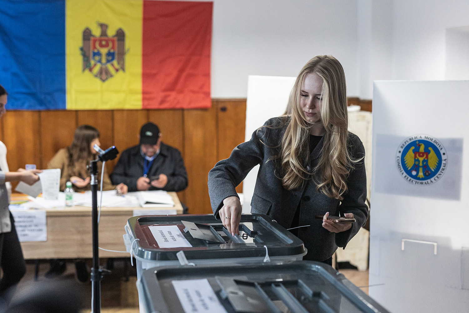 Woman votes at voting booth in Moldova